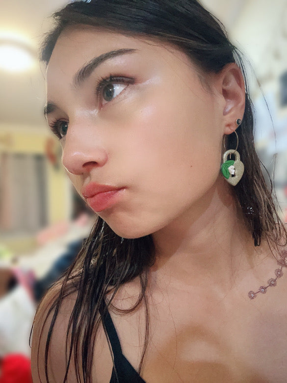 Mikayla wearing our gold heart-lock hoops