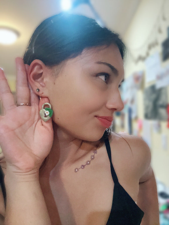 Mikayla wearing our gold heart-lock hoops